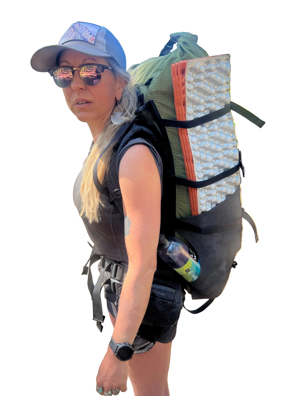 Person hiking in a forest with a large backpack
