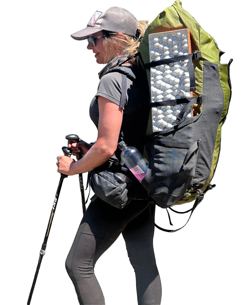 Person hiking with a large backpack, walking stick, and water bottle on a gray background